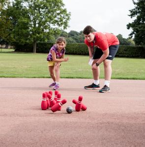 Chester Camp summer 2018-28 coach and child playing skittles