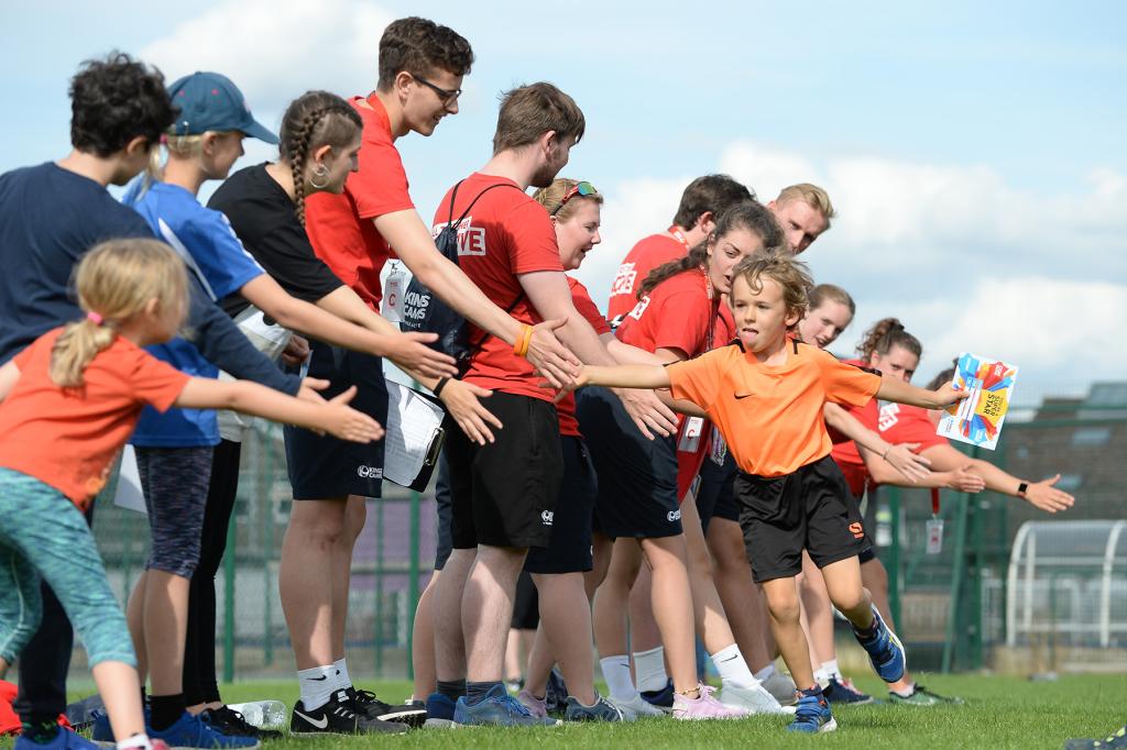 Red Tops and child high five-ing!